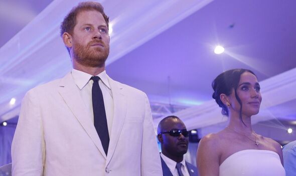 Harry and Meghan looking serious