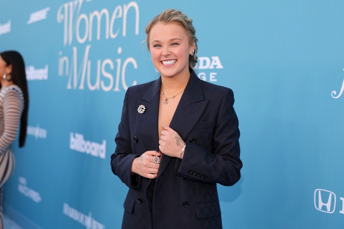JoJo Siwa in a dark suit