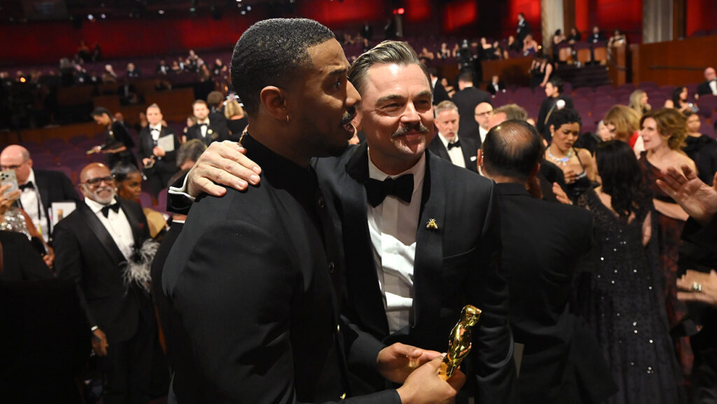 Leonardo DiCaprio reacts with Michael B. Jordan, winner of the best Actor award for Sinners after the 98th Oscars at Dolby Theatre on March 15, 2026 in Hollywood, California.