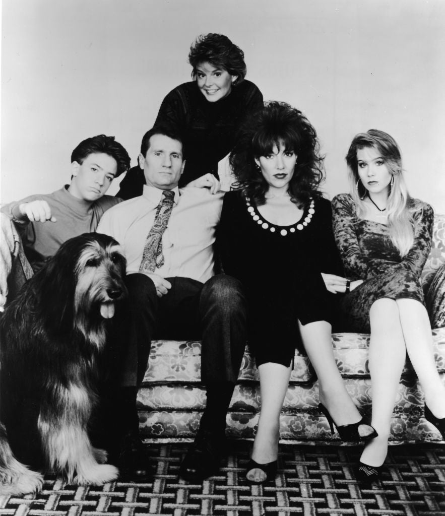 Applegate (right) on 'Married... With Children' in 1990, aged 18