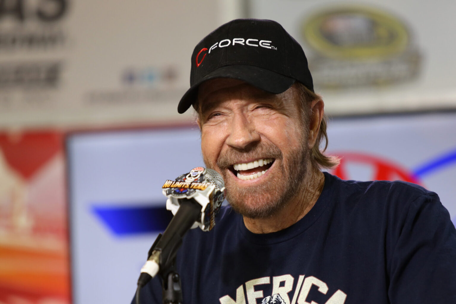 Actor Chuck Norris speaks with the media during a press conference prior to the NASCAR Sprint Cup S...