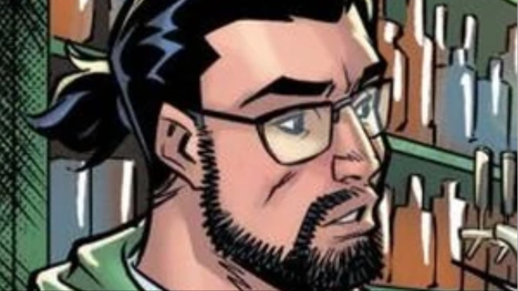 Paul Rabin in front of a wall of liquor