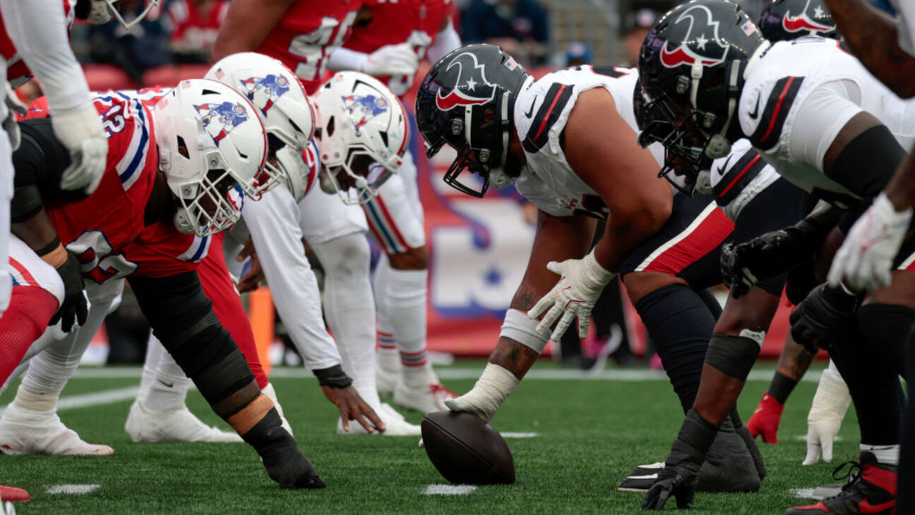At the line of scrimmage during a game between the New England Patriots and the Houston Texans: How to watch Houston Texans vs. New England Patriots online, livestream Sling TV