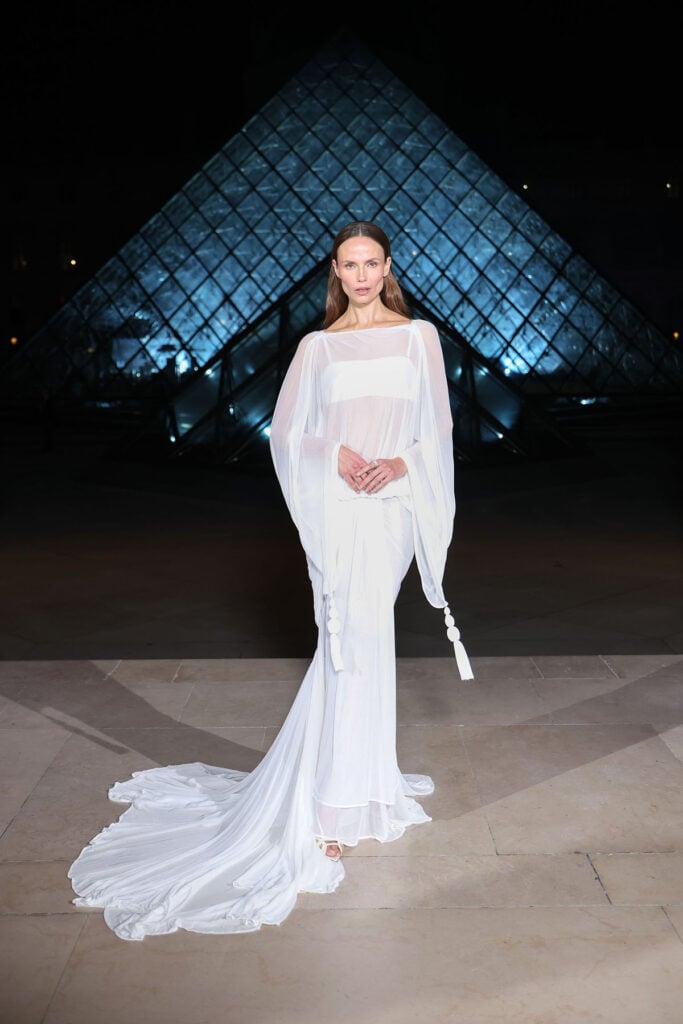 Natasha Poly Le Grand Dîner du Louvre, Natasha Poly Louvre Dinner Paris red carpet, Natasha Poly Paris fashion event Louvre dinner, Le Grand Dîner du Louvre red carpet Natasha Poly, Jacquemus Natasha Poly sheer dress, Jacquemus Spring 2026 Natasha Poly Louvre dinner