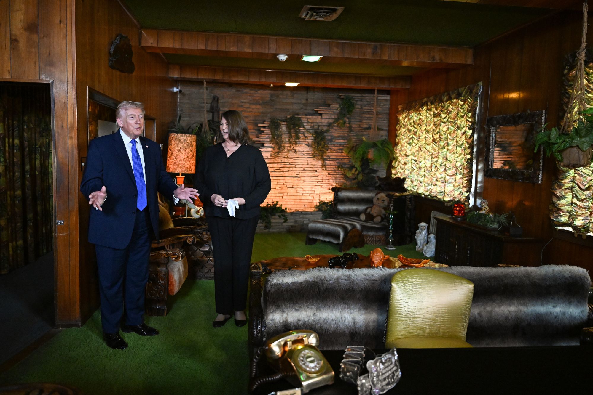 Trump, pictured in Graceland’s ‘Jungle Room,’ failed to list any of Presley’s most famous tracks when asked by reporters for his favorite