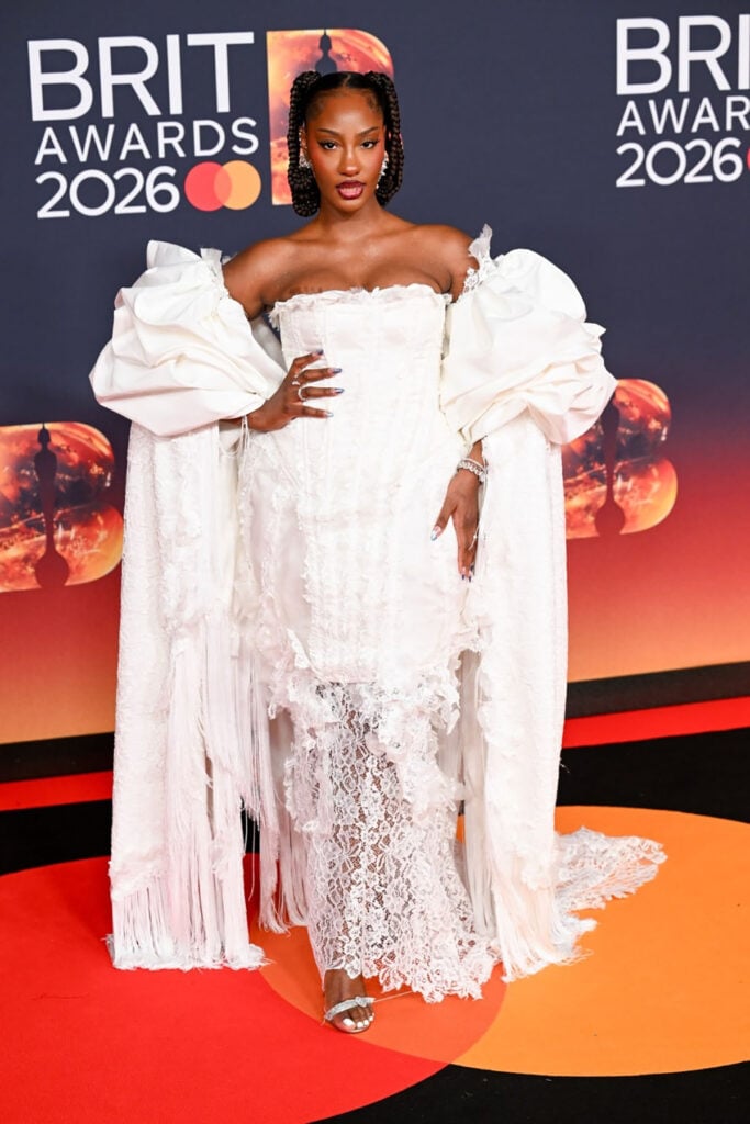 Tems BRIT Awards 2026, Tems white dress, Tems red carpet style, Tems lace gown, BRIT Awards 2026 best dressed, Tems fashion 2026