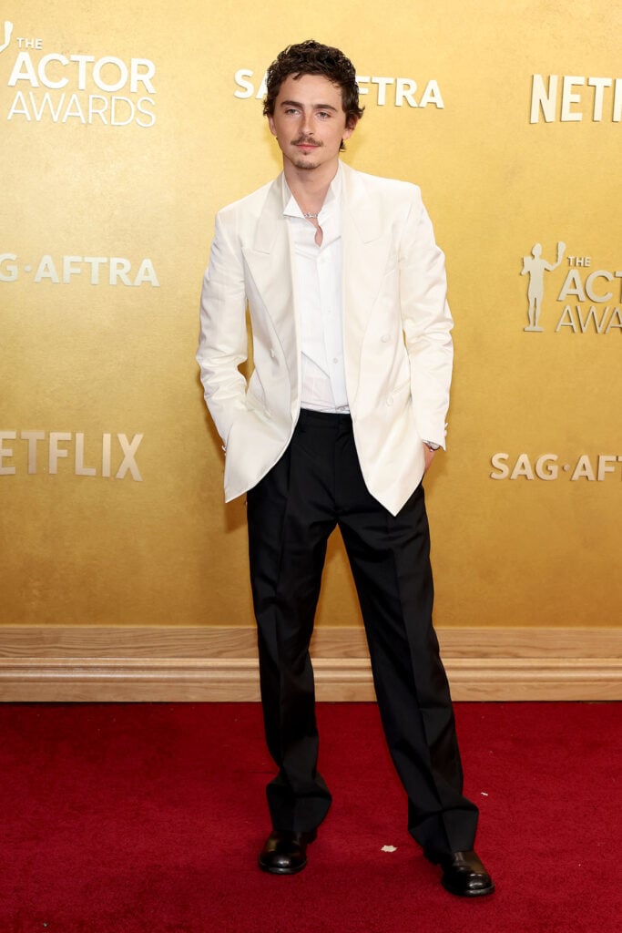 Timothée Chalamet Prada Actor Awards 2026, oversized Prada suit, Timothée Chalamet red carpet style, relaxed tailoring trend, Urban Jürgensen UJ 2 platinum watch, menswear awards season 2026