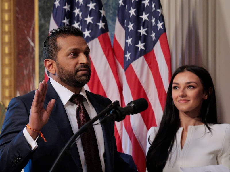FBI Director Kash Patel speaks as his girlfriend Alexis Wilkins (C) looks on during his swearing-in ceremony on Feb. 21, 2025, in Washington, DC.