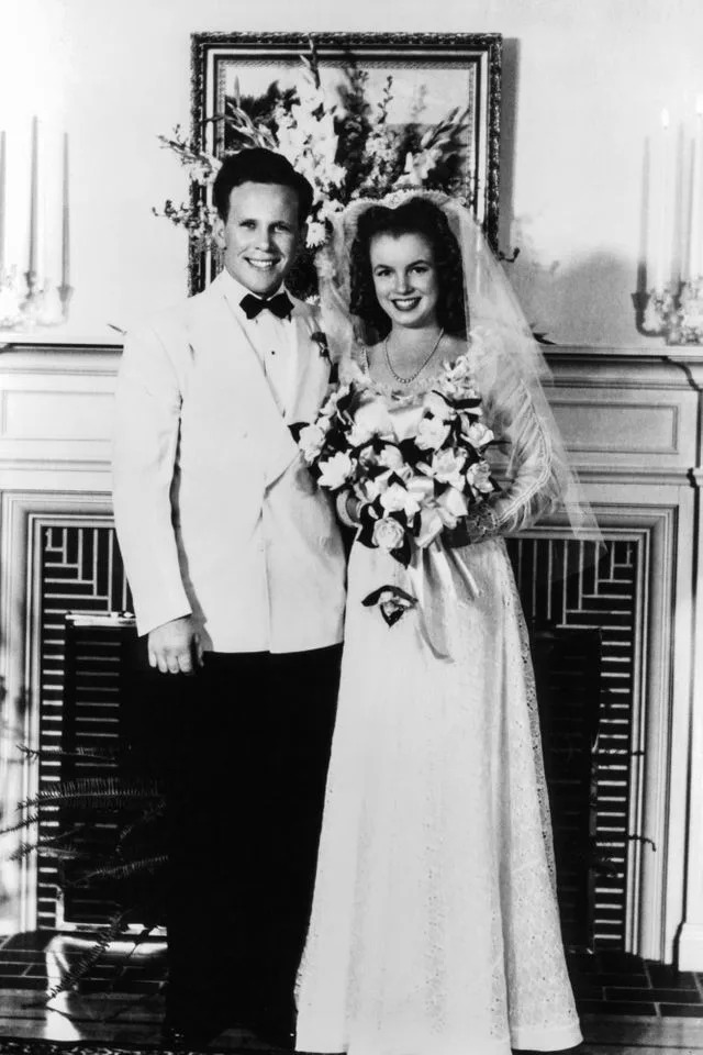 James Dougherty and Marilyn Monroe pose for a photo on their wedding day in L.A. on June 19, 1942Credit: Getty Images