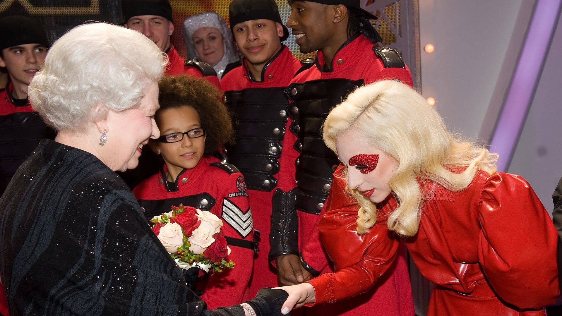 Lady Gaga curtseying to the Queen