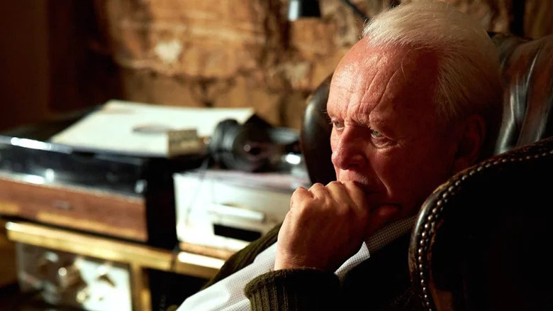 Anthony (Anthony Hopkins) sitting in a chair in The Father