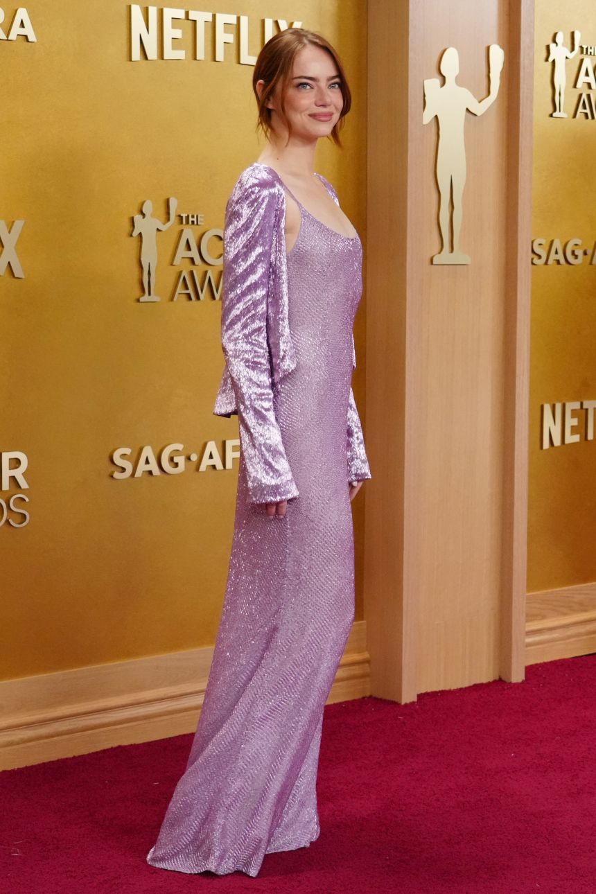 Emma Stone wore a lilac Louis Vuitton slip dress with a matching cardigan.