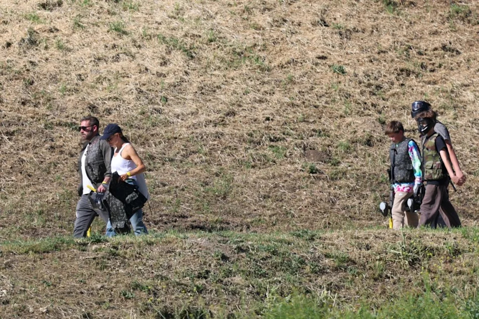 They were seen walking with their son and his friends following behind. BACKGRID