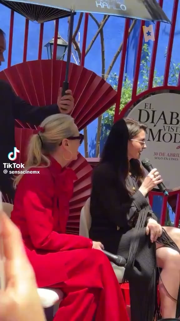 Meryl Streep shows her appreciate to the umbrella holder during the ‘Devil Wears Prada 2’ press tour