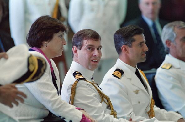 Andrew sits in white military uniform