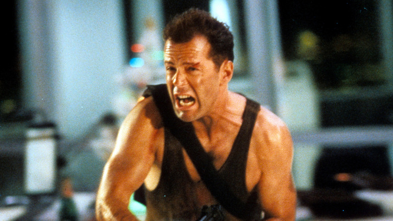Bruce Willis as John McClane wearing a vest