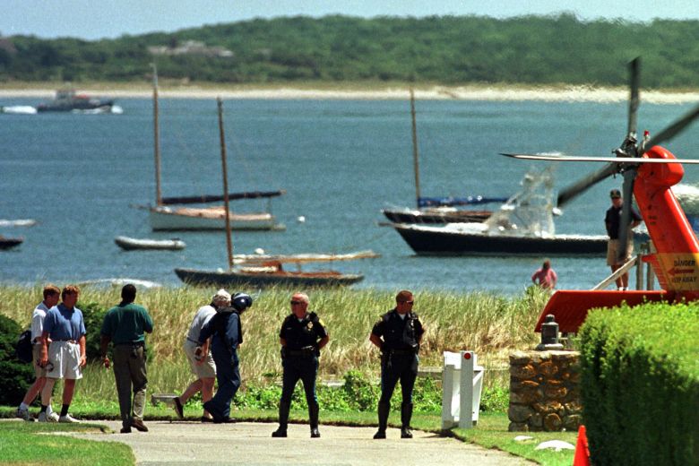 Sen. Edward Kennedy (center left, wearing shorts) is escorted to a Coast Guard helicopter at the Kennedy compound on July 21, 1999 in Hyannis Port, Massachusetts.