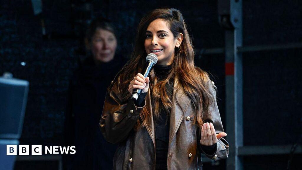 How deepfake porn scandal surrounding TV star rocked Germany A woman in a brown leather jacket and brown hair holds a microphone