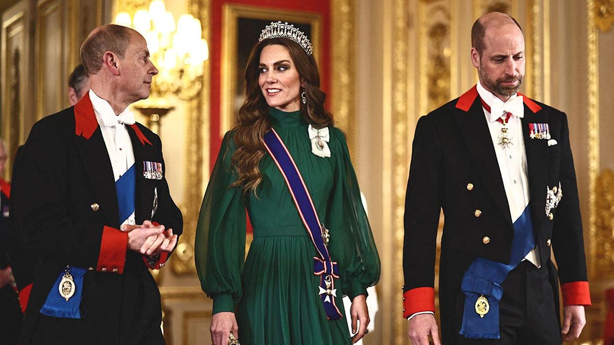 Kate Middleton standing in between Prince Edward and Prince William for the state banquet.