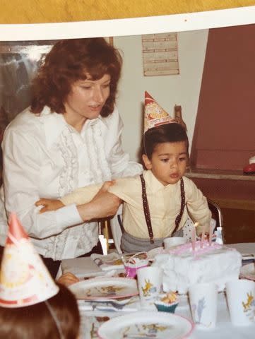 Mark Consuelos blowing out birthday candles as a child.Credit: Kelly Ripa/Instagram