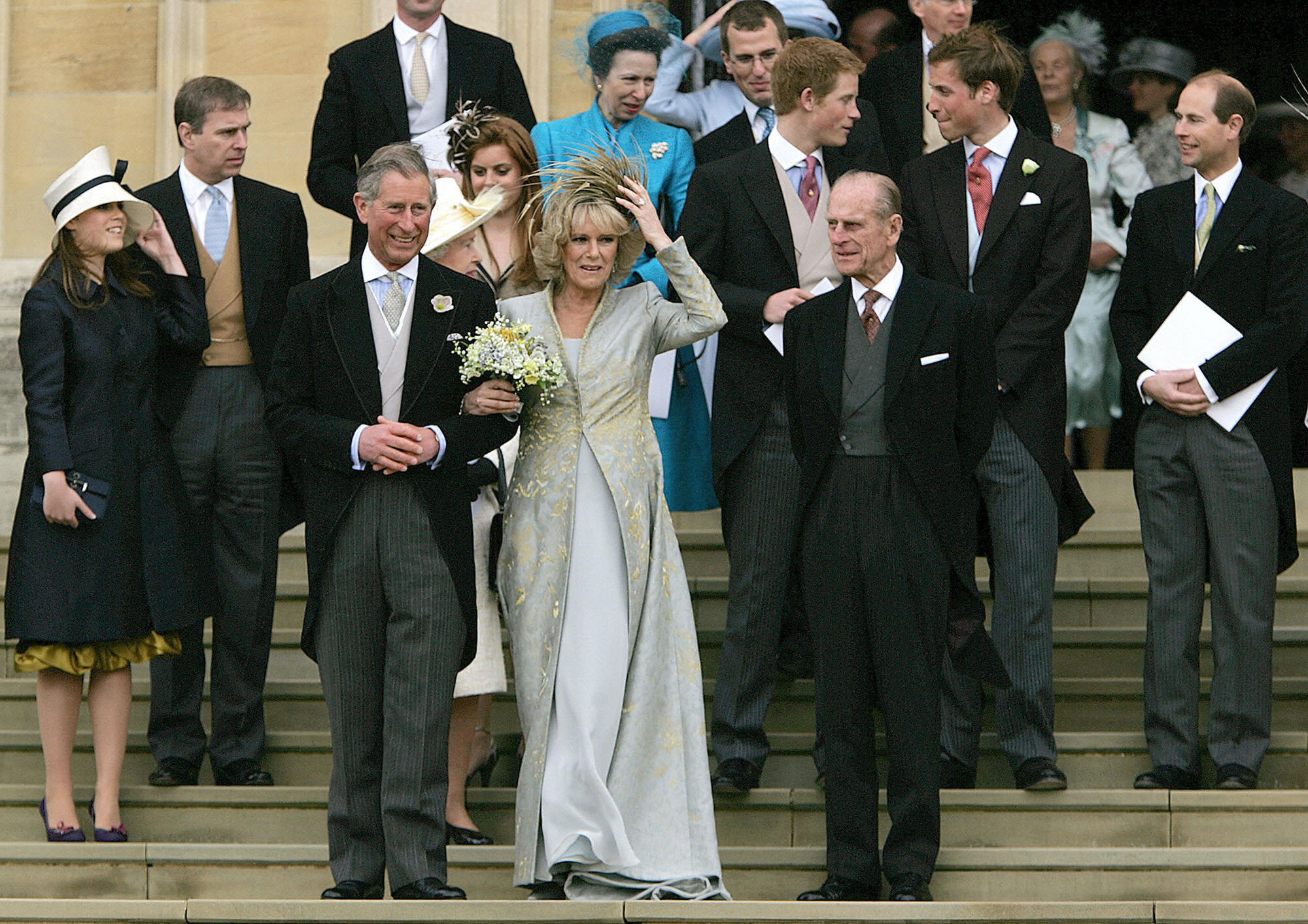 Queen Camilla and King Charles on their wedding day with members of the royal family behind them