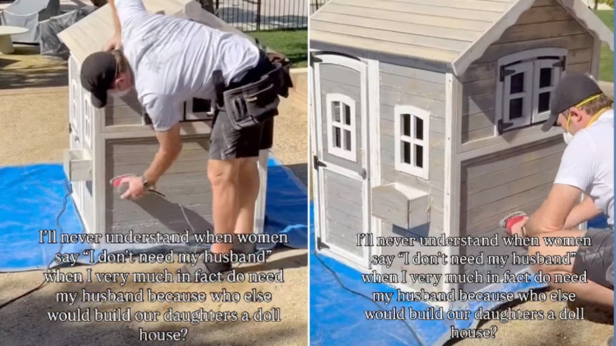Chris Pratt wearing a cap and casual work clothes paints a small wooden playhouse outdoors while standing on a blue tarp.