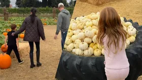 New Photos Show Meghan Markle and Prince Harry’s Pumpkin-Picking Day With Archie and Lilibet