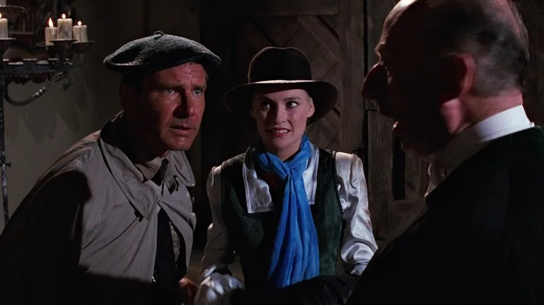 Indiana Jones disgused as a Scottish lord and Elsa disguised as his assistant in Indiana Jones and the Last Crusade