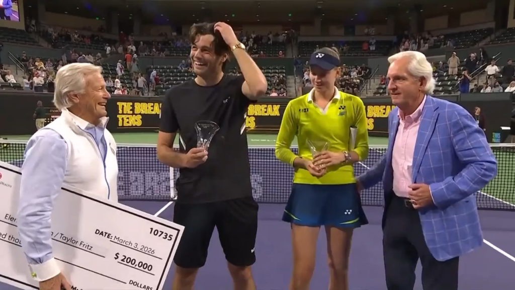 Check presenter tries to put his hand around tennis player Elena Rybakina’s waist but she moves it immediately