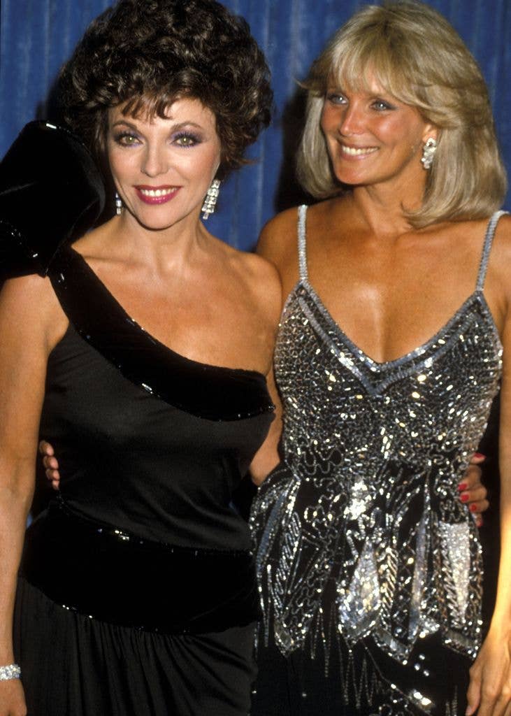 Actresses Joan Collins and Linda Evans attend the 35th Annual Primetime Emmy Awards on September 25, 1983 