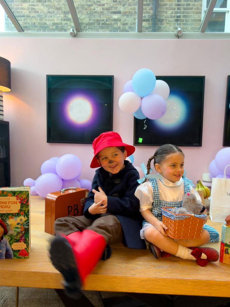Ashley James' children in Paddington Bear and Wizard of Oz outfits on their breakfast table