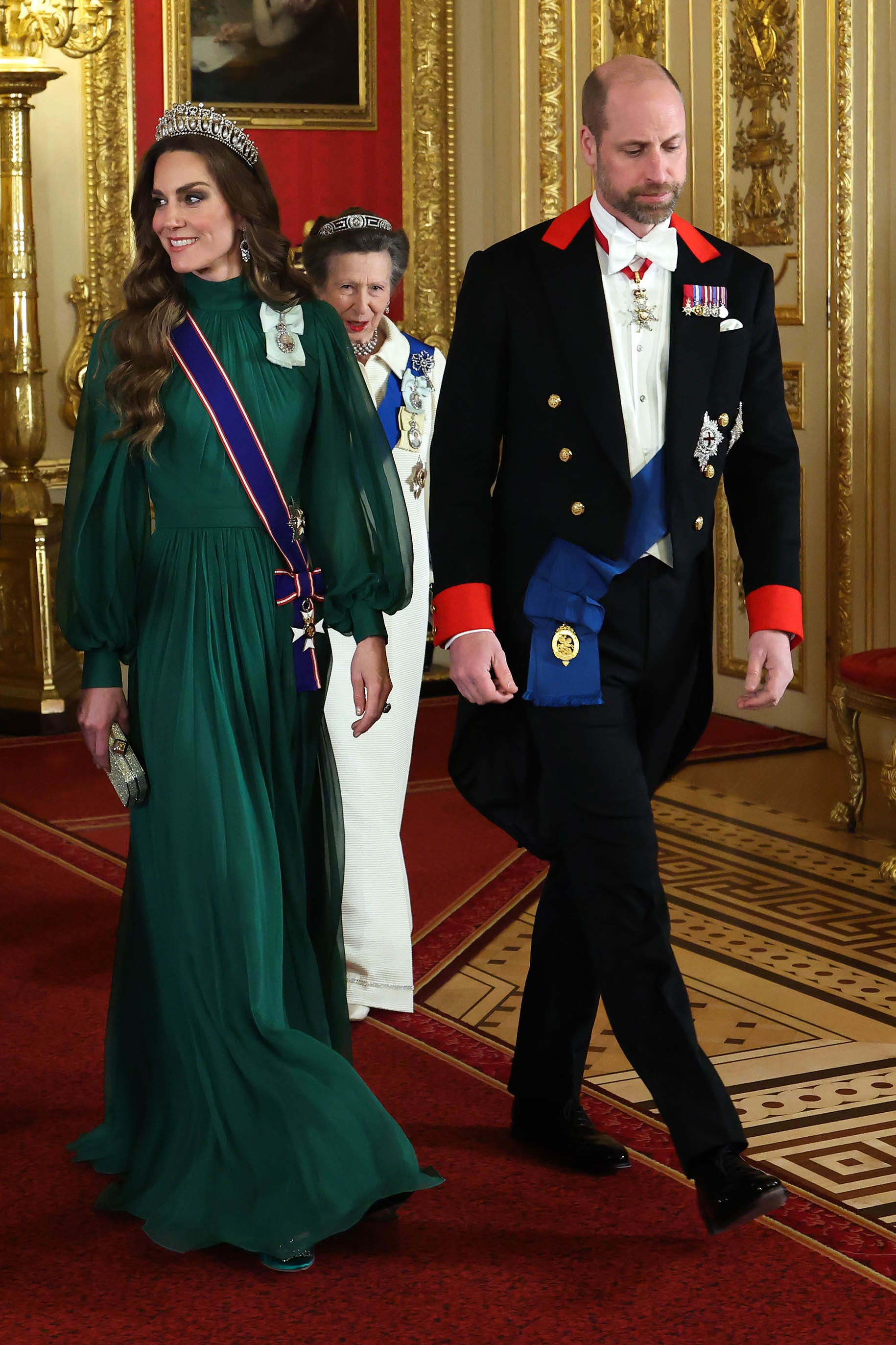 Formal event featuring individuals in elegant attire.