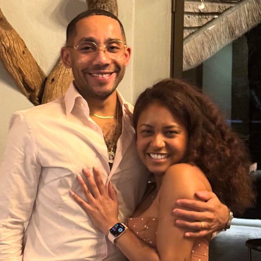 Couple posing together in an indoor setting with natural elements. Couple posing together in an indoor setting with natural elements.