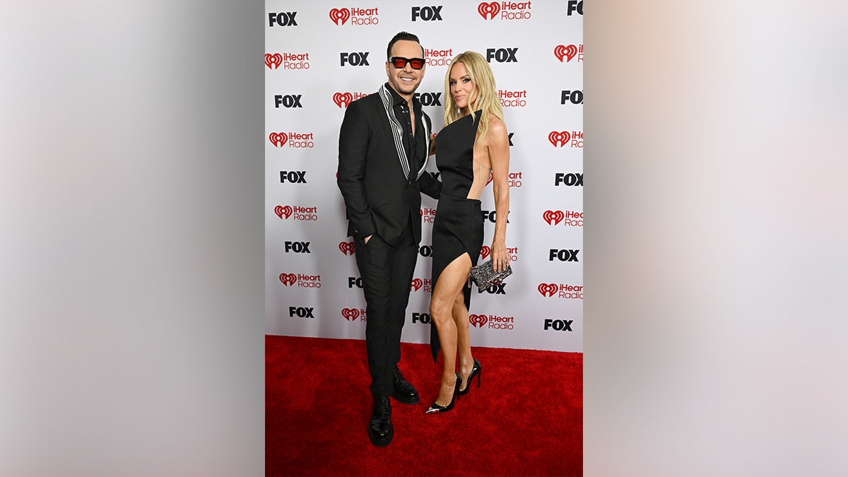 Jennie McCarthy and Donnie Wahlberg walked the red carpet together in matching black outfits.