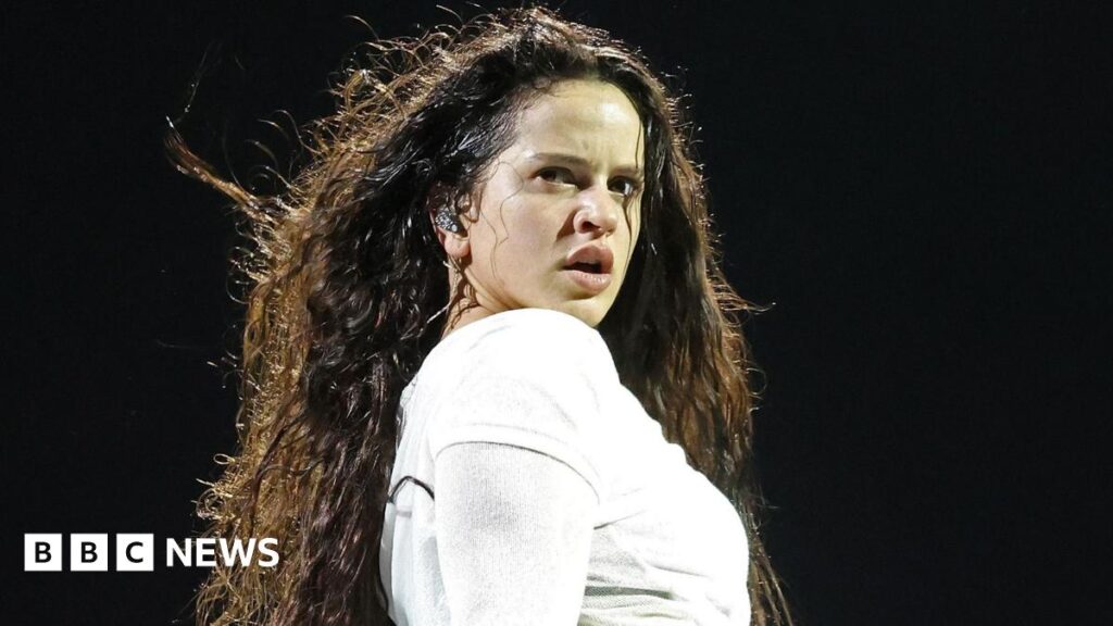 Spanish singer Rosalia tosses her hair as she turns to look at the audience during a concert on her 2022 Motomami tour in Seville, Spain