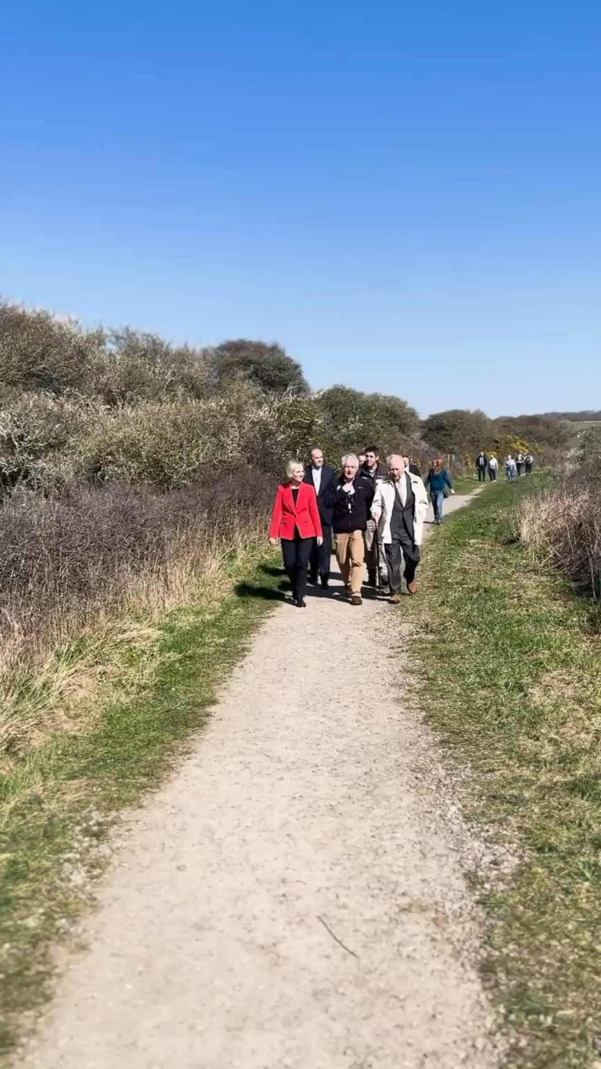 King Charles hiking today in a two piece suit at the launch of the world’s longest coastal path in Sussex