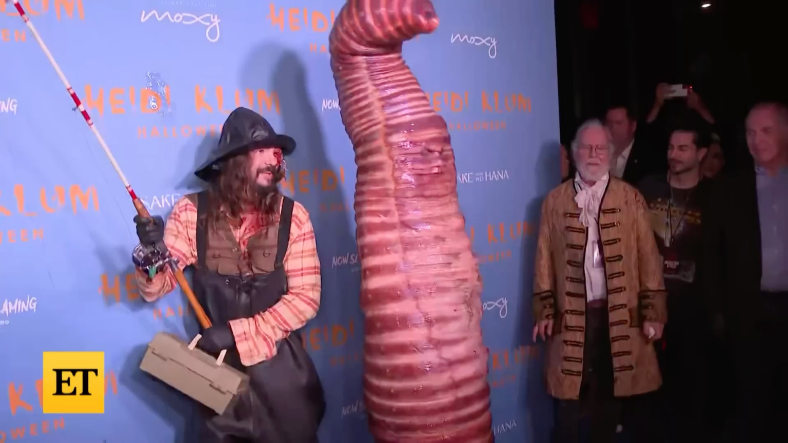 Heidi Klum being interviewed as a worm for Halloween