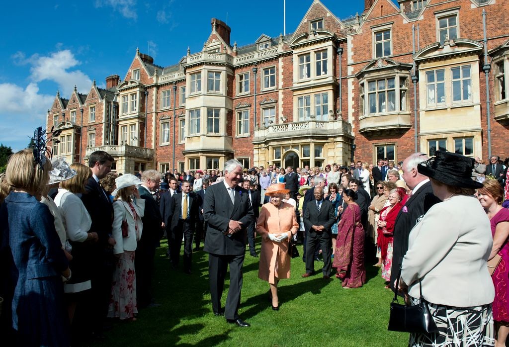 Queen Elizabeth II greets guests during a garden party in honour of her Diamond Jubilee at the Queen's Sandringham Estate on June 12, 2012 in Norfolk, England