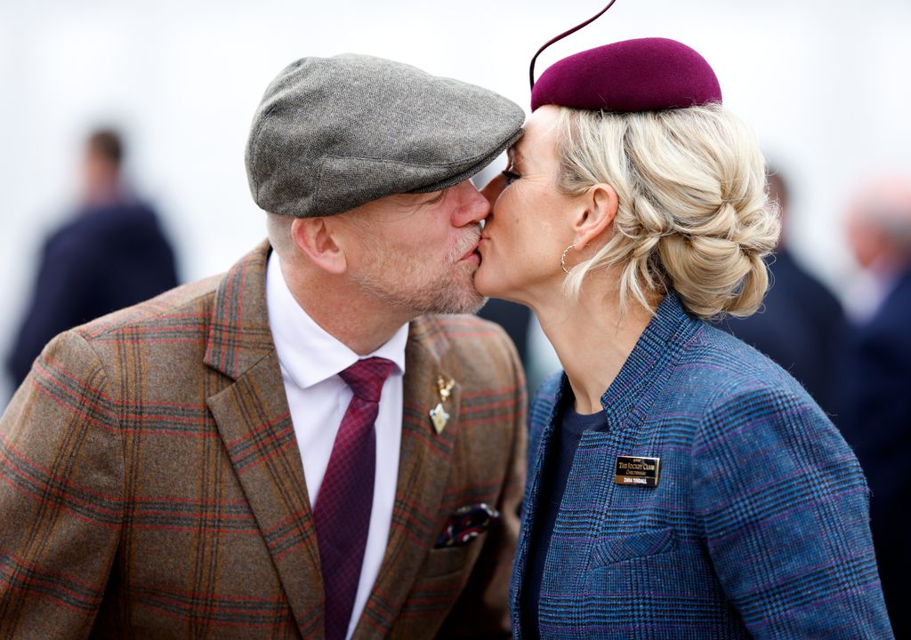 Mike and Zara Tindall kiss at Cheltenham Festival