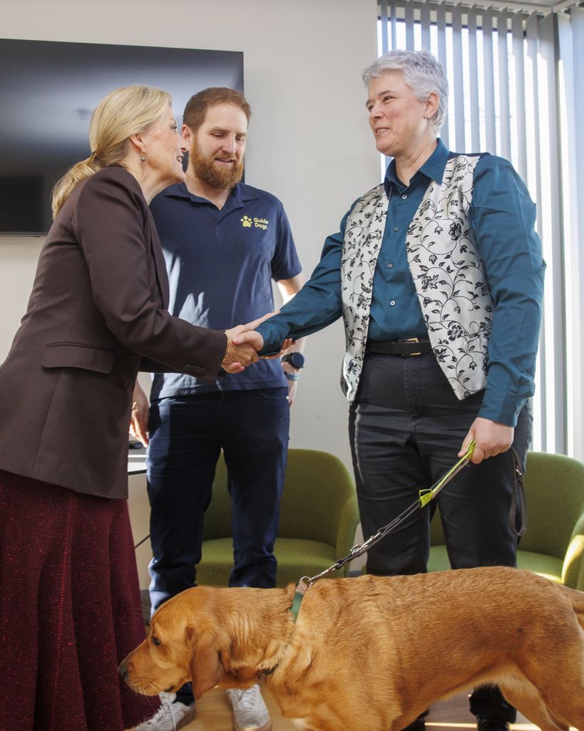 The Duchess of Edinburgh (left) meeting service user Diane Marks (right) with her guide dog Biscuit 