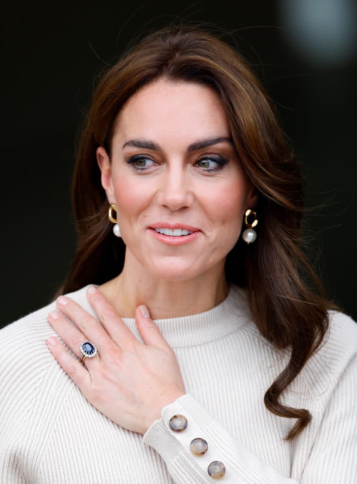 Kate Middleton wearing her blue sapphire and diamond engagement ringCredit: Getty