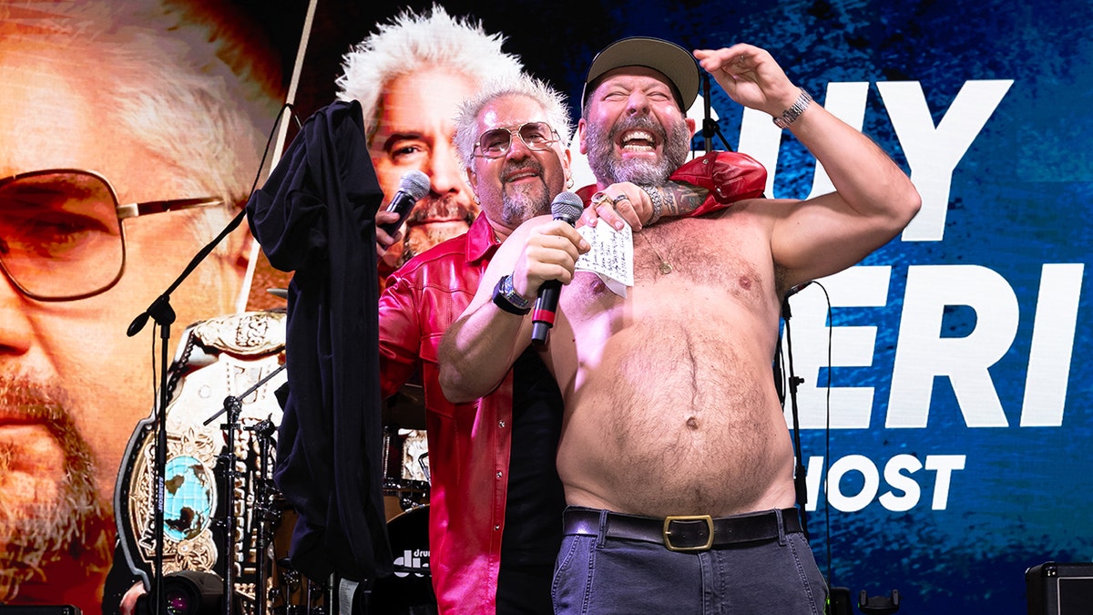 Guy Fieri and a shirtless Bert Kreischer embrace at the 2026 South Beach Wine & Food Festival.