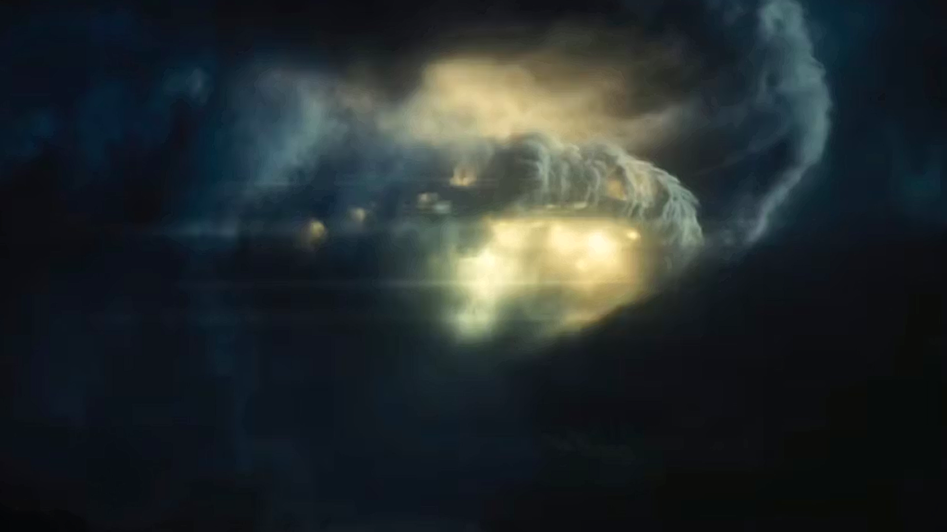 a flying saucer emerges from a cloud