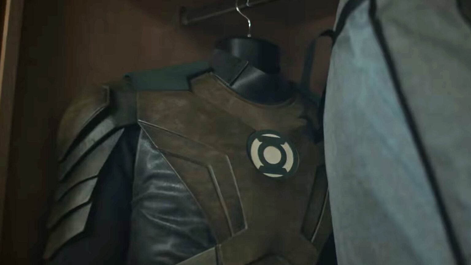 Hal Jordan's brownish Green Lantern uniform hanging in a closet