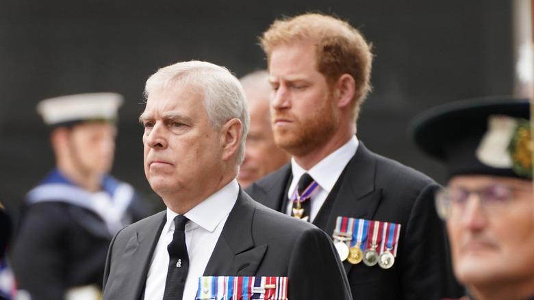 Prince Harry walking behind Andrew Mountbatten-Windsor