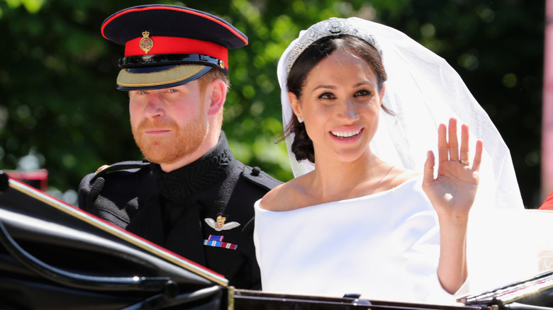 Prince Harry, Duke of Sussex and Meghan, Duchess of Sussex ride the Ascot Landau Carriage during their carriage procession on Castle Hill outside Windsor Castle (2018)
