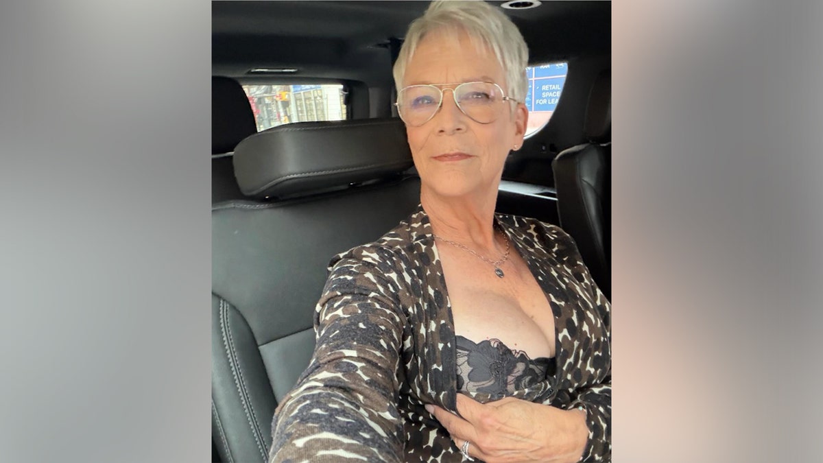 Jamie Lee Curtis in lingerie in a limo.