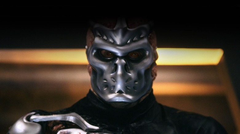 A cybernetically enhanced Jason Voorhees (Kane Hodder) stands menacingly in Jason X