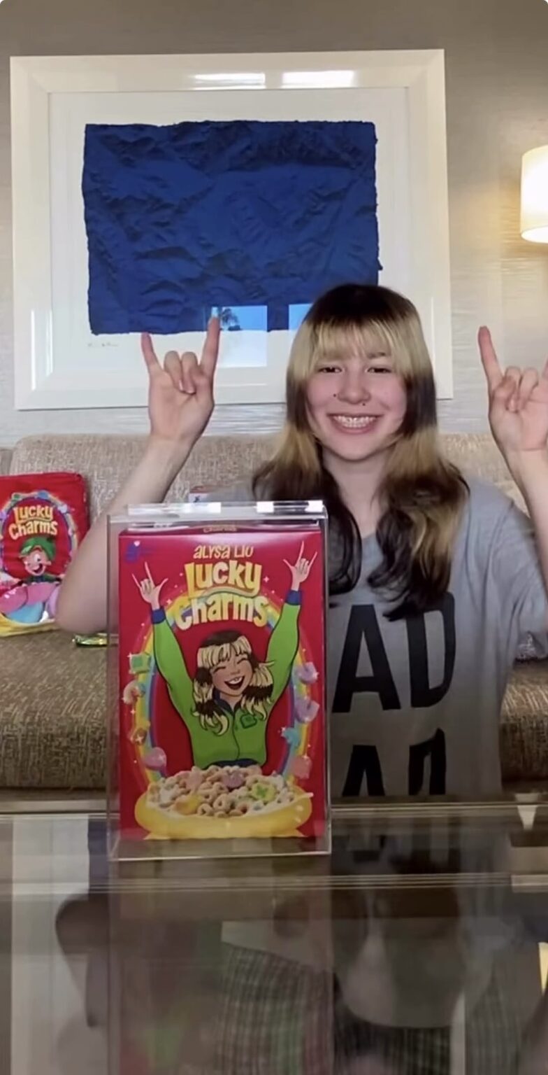 Alysa Liu showing off her new Lucky Charms Collab box