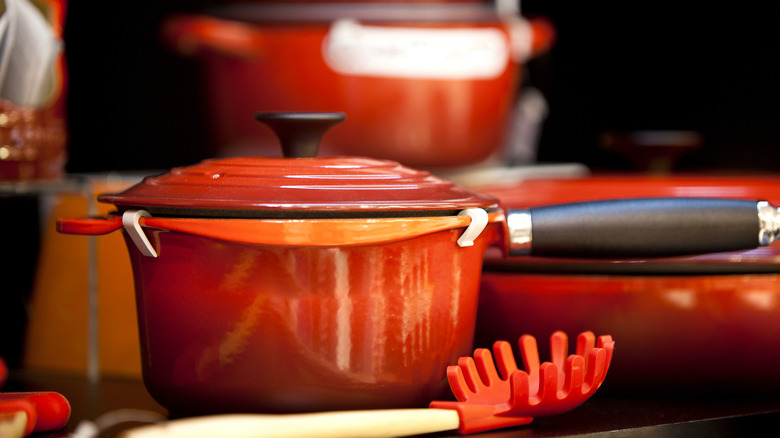 A red cast iron Le Creuset saucepan